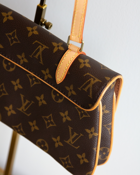 Louis Vuitton Double Buckle Pouchette Bag